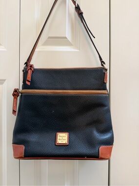 Dooney & Bourke Black Pebbled Leather Tote with Brown Trim and Gold Plaque